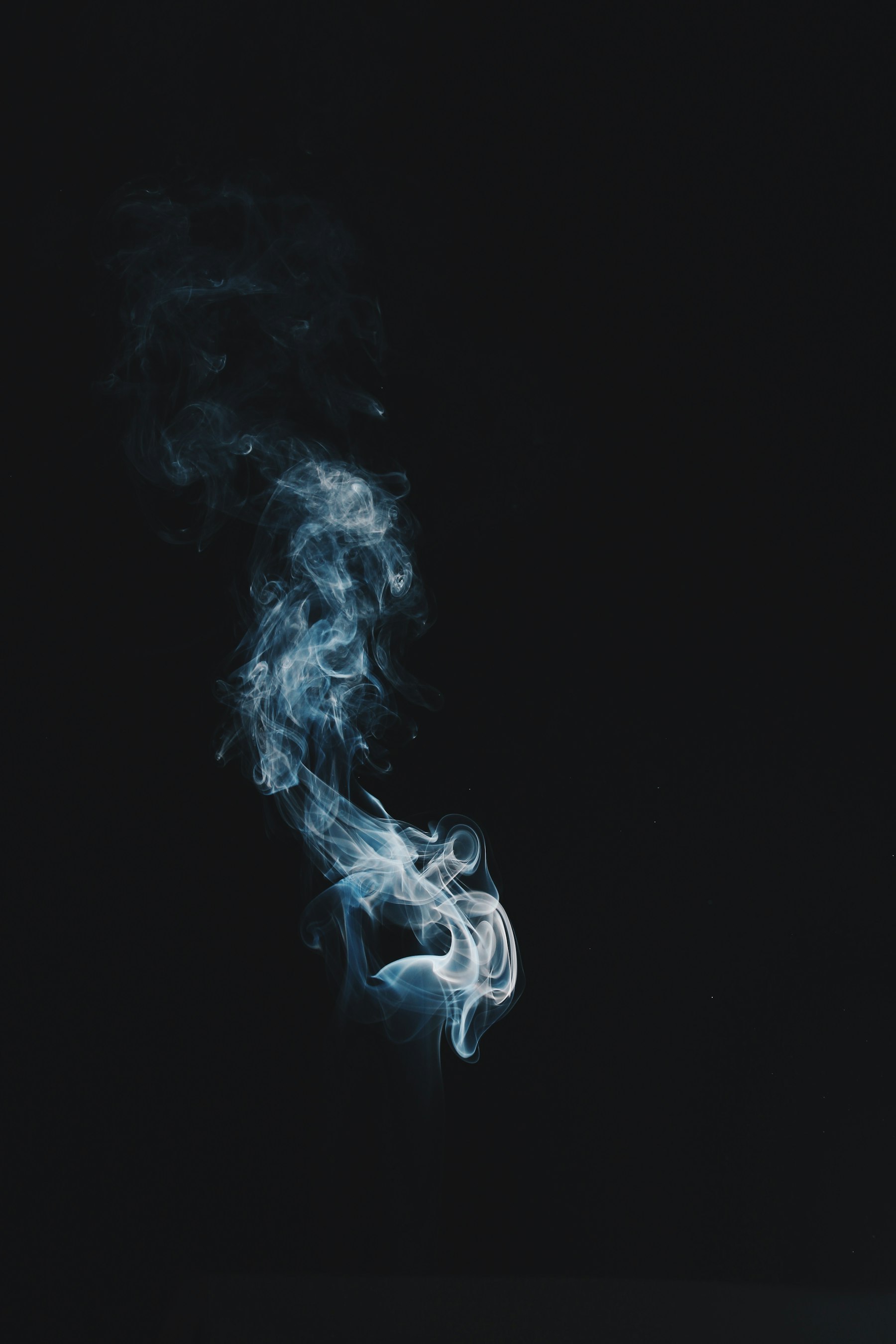 A single wisp of vapour on black